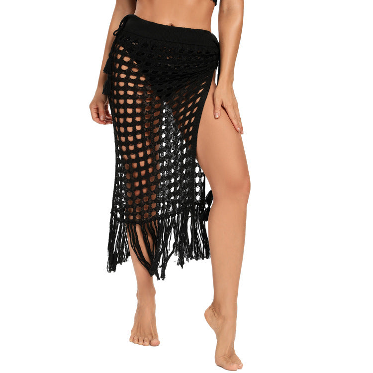 2020 spring and summer new European and American women's clothing sexy see-through hollow knitted skirt slit fringed beach skirt