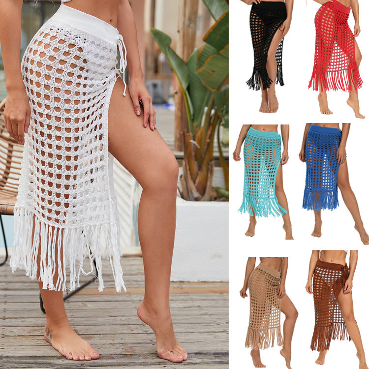 2020 spring and summer new European and American women's clothing sexy see-through hollow knitted skirt slit fringed beach skirt