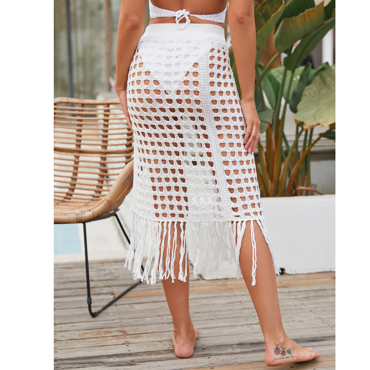 2020 spring and summer new European and American women's clothing sexy see-through hollow knitted skirt slit fringed beach skirt