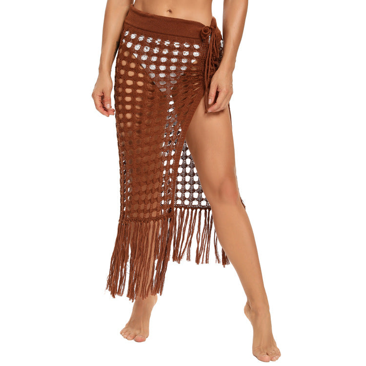 2020 spring and summer new European and American women's clothing sexy see-through hollow knitted skirt slit fringed beach skirt